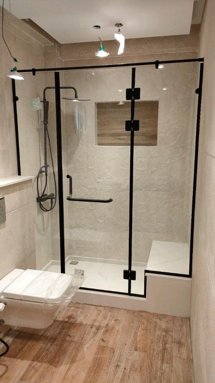Black-framed shower cubicle with sliding barn-style glass door