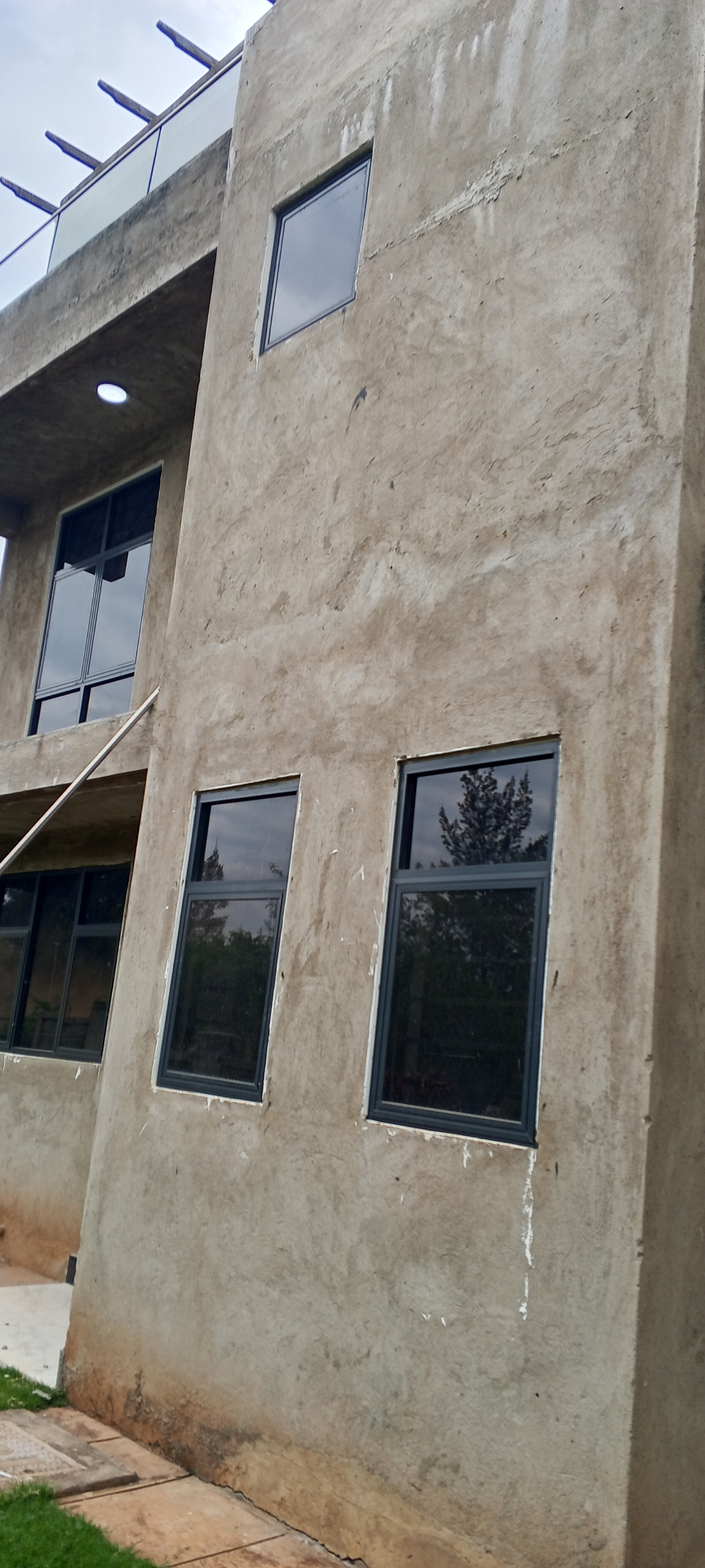 Top-hinged aluminum awning windows on a multi-storey building